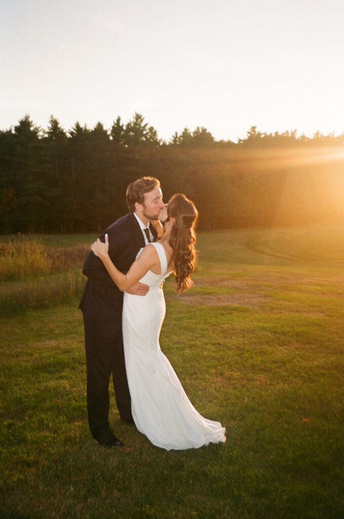 35mm film wedding photo of couple at sunset during a Fall wedding in NH