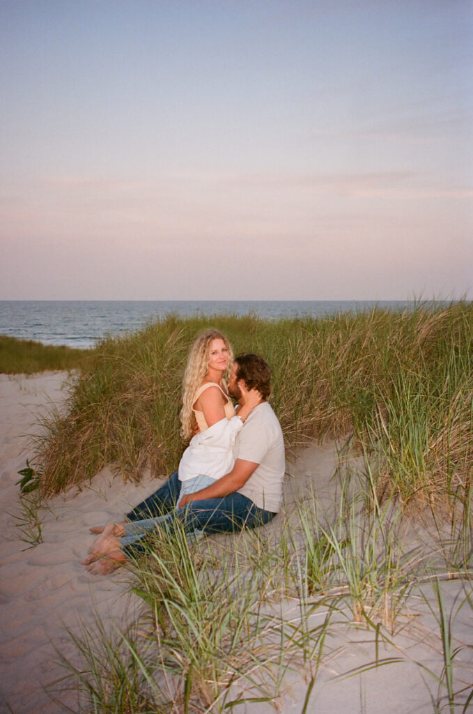 35mm film engagement photo of couple on Hampton Beach at sunset
